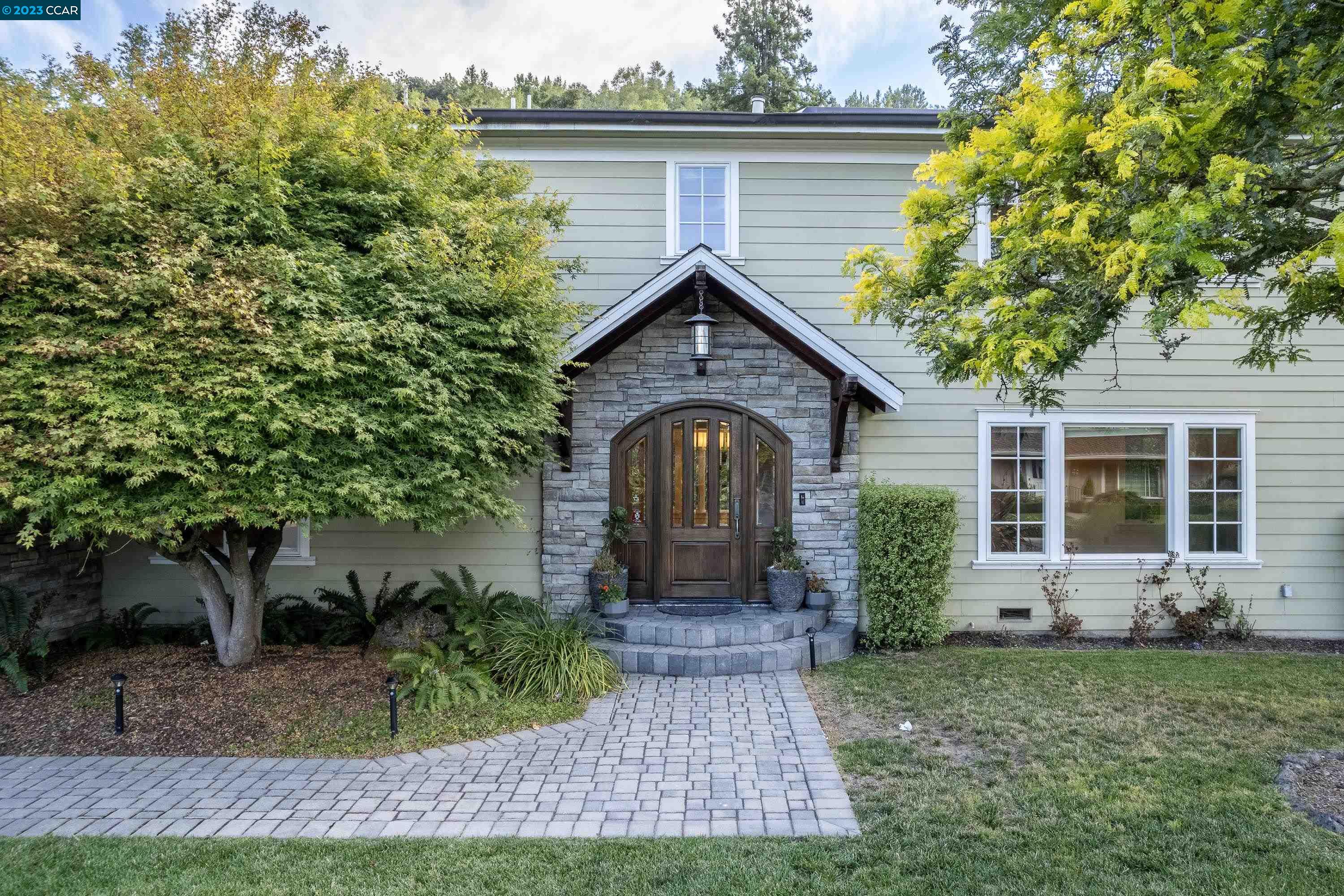 1206 Rimer Drive Moraga, CA 94556 - Photo 2 of 53 a front view of a house with garden