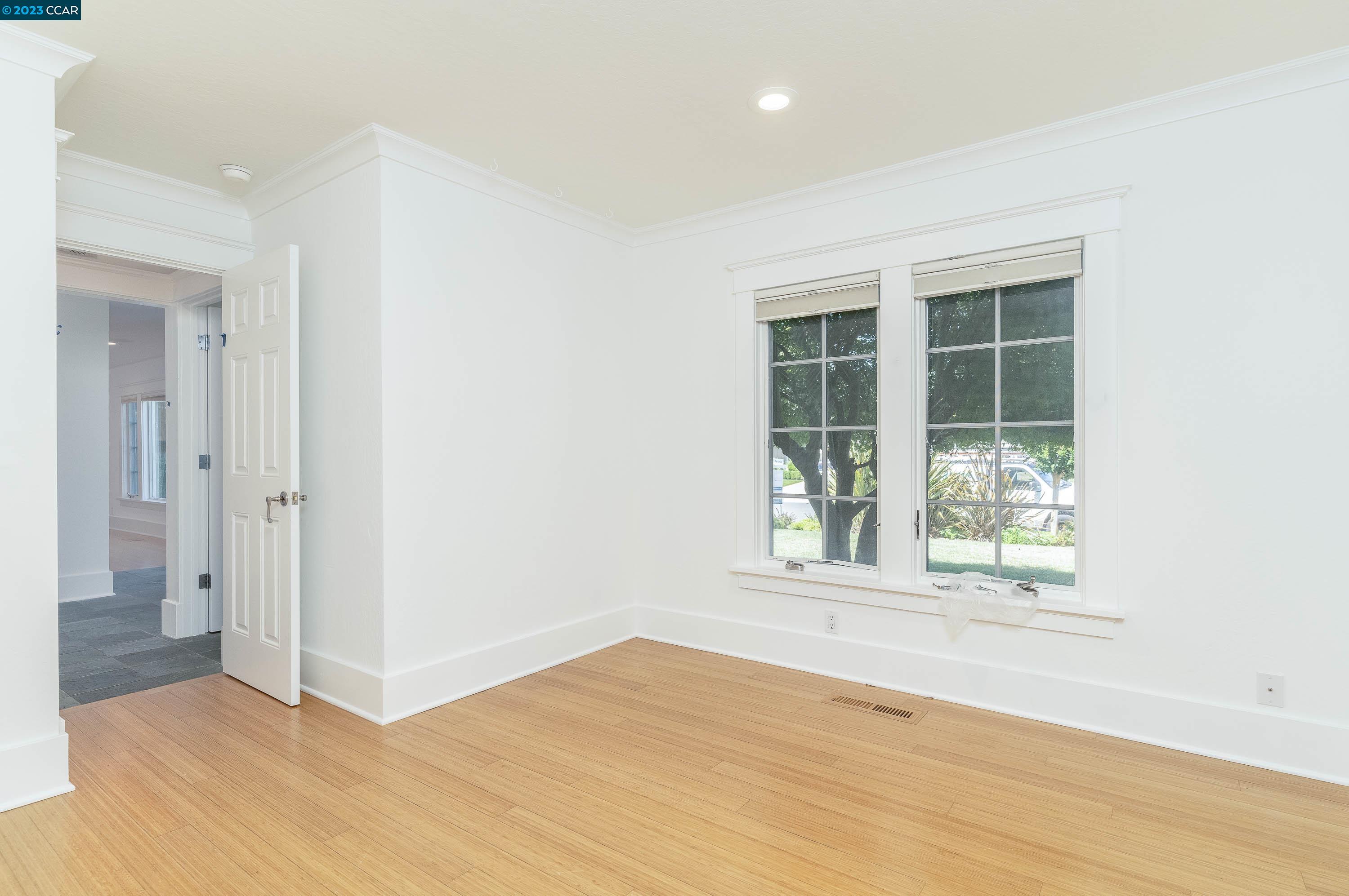 1206 Rimer Drive Moraga, CA 94556 - Photo 31 of 53 an empty room with wooden floor and windows