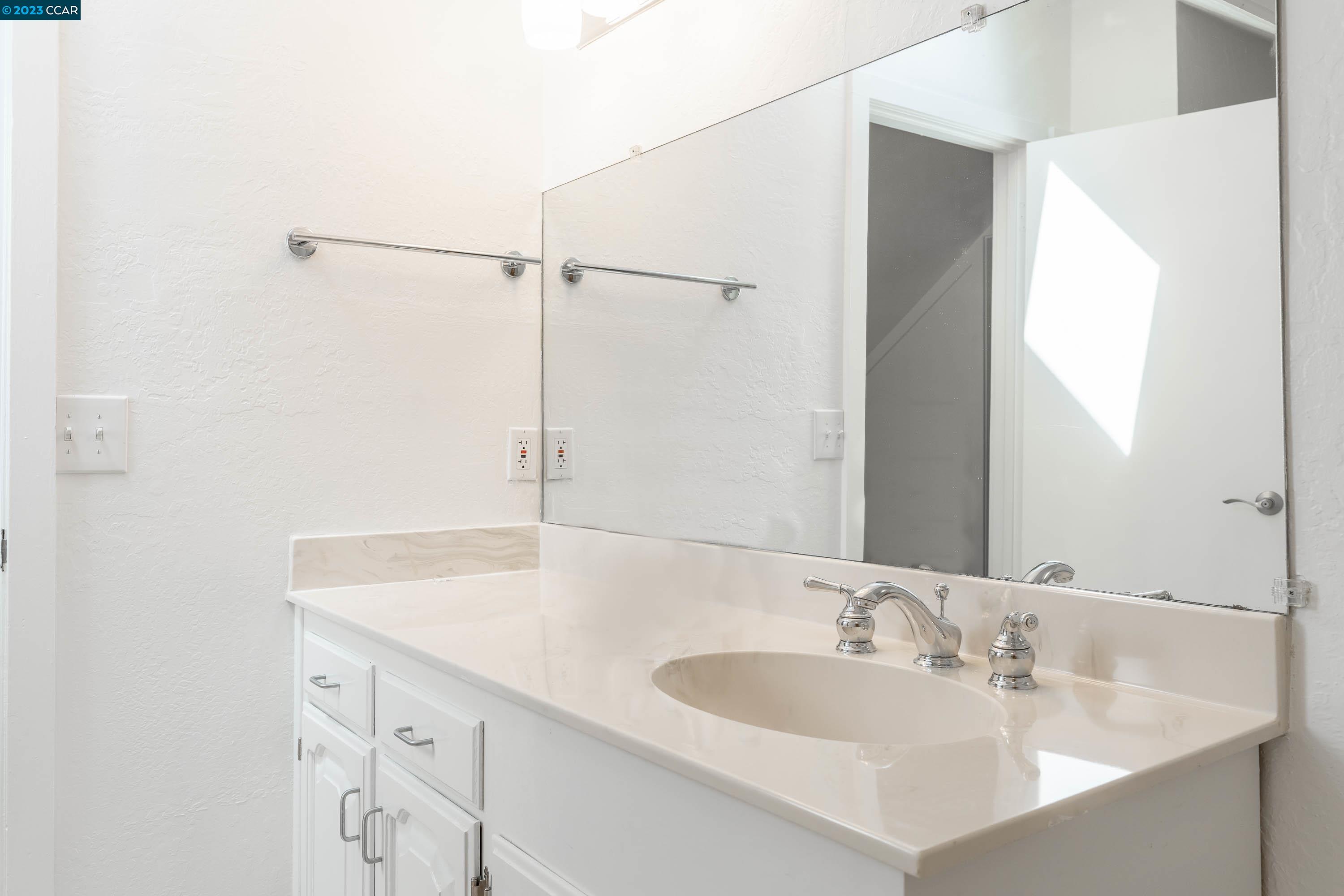 1206 Rimer Drive Moraga, CA 94556 - Photo 33 of 53 a bathroom with a sink and a large mirror