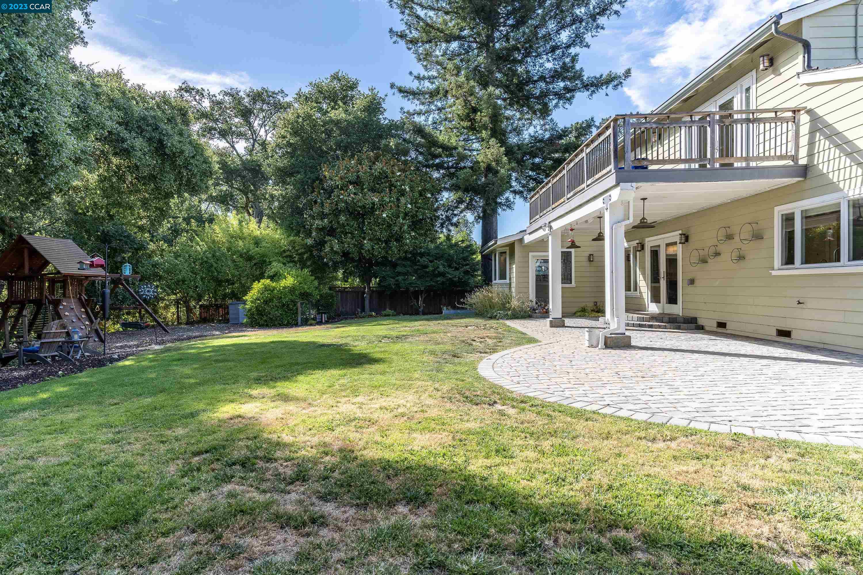 1206 Rimer Drive Moraga, CA 94556 - Photo 44 of 53 a backyard of a house with table and chairs