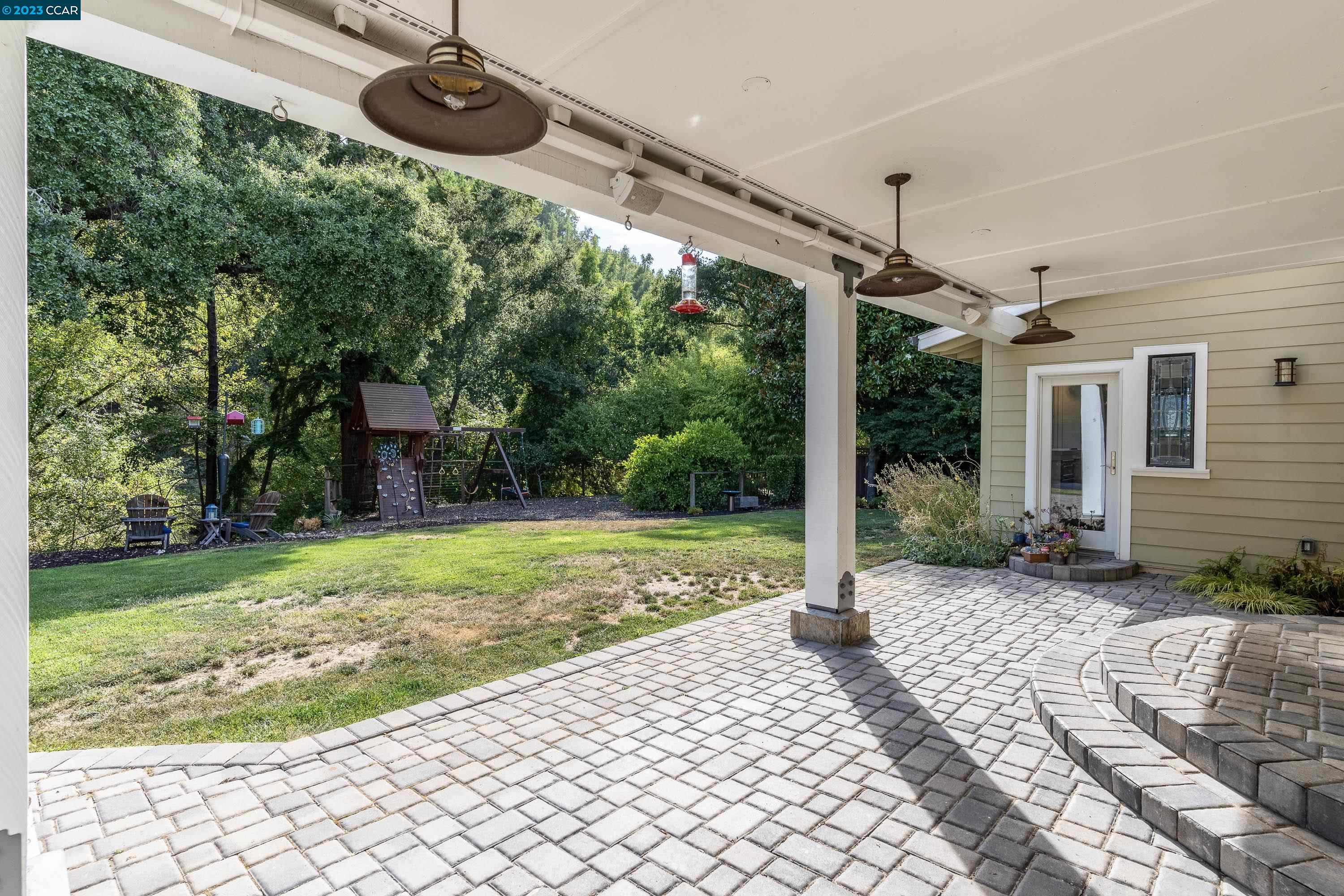 1206 Rimer Drive Moraga, CA 94556 - Photo 45 of 53 a backyard of a house with garden and outdoor seating