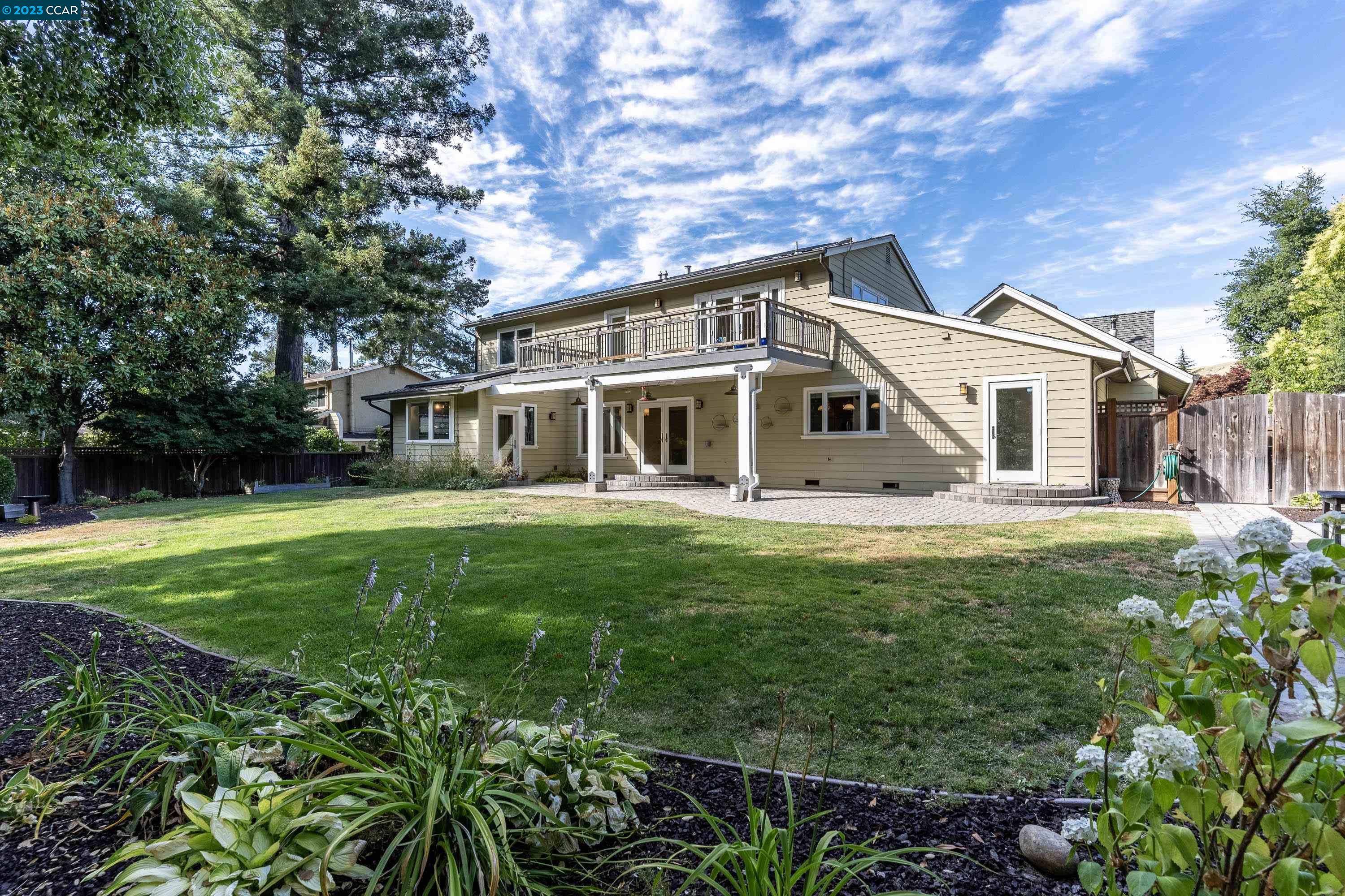 1206 Rimer Drive Moraga, CA 94556 - Photo 47 of 53 a front view of a house with a yard table and chairs