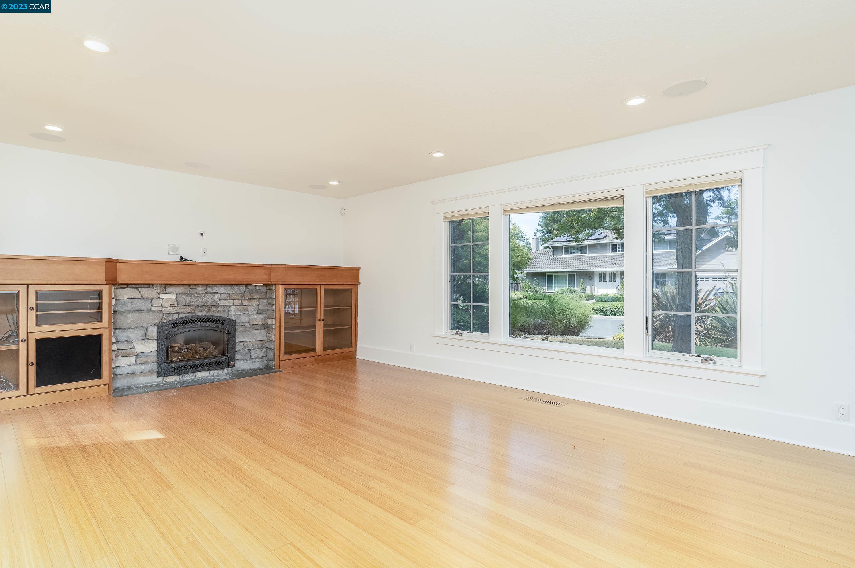 1206 Rimer Drive Moraga, CA 94556 - Photo 7 of 53 an empty room with windows and a fireplace