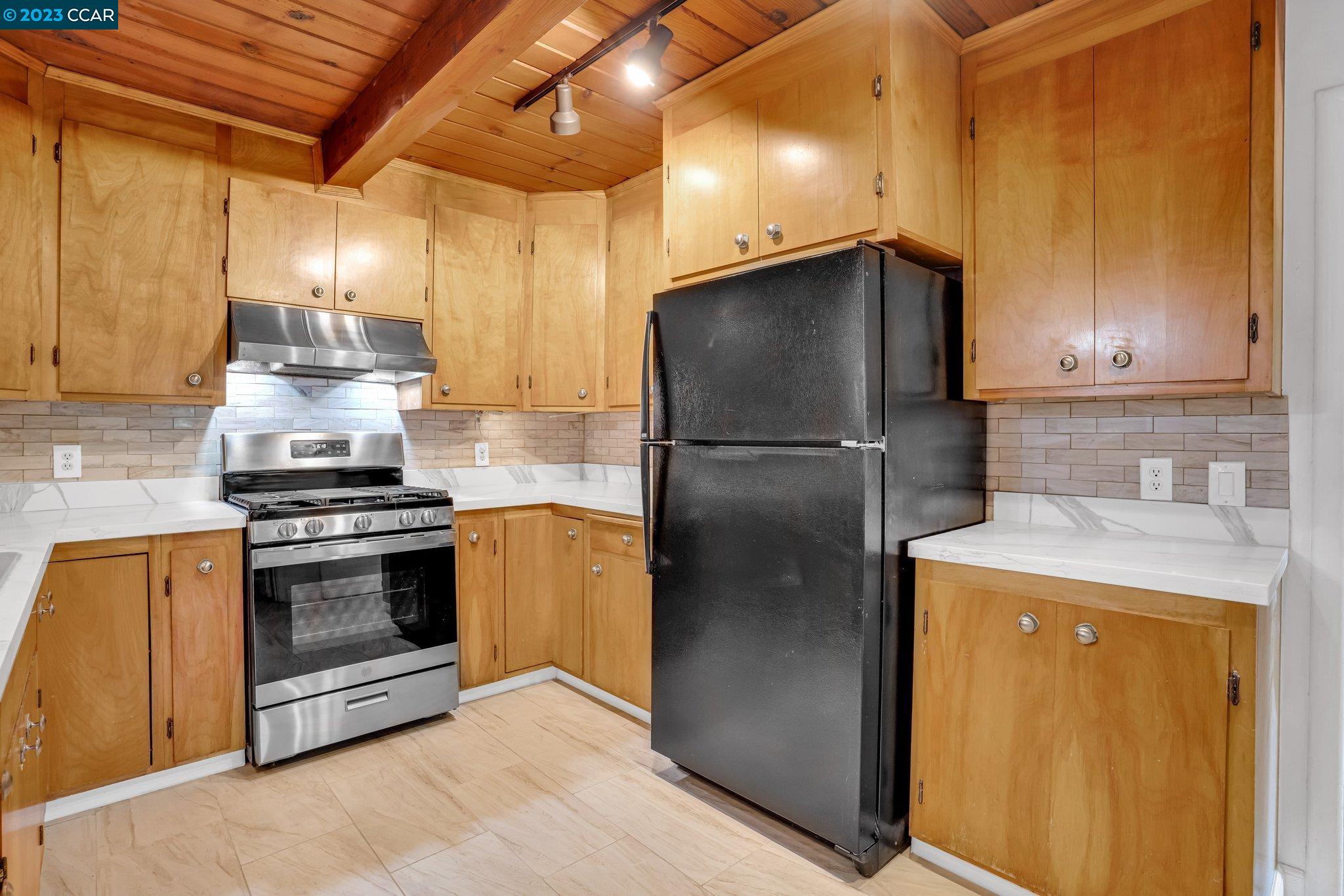 928 Janet Lane Lafayette, CA 94549 - Photo 11 of 33 a kitchen with a refrigerator sink and cabinets