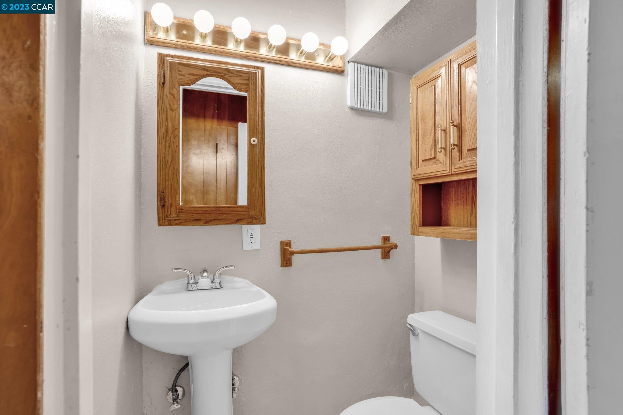 928 Janet Lane Lafayette, CA 94549 - Photo 26 of 33 a bathroom with a sink and mirror with toilet