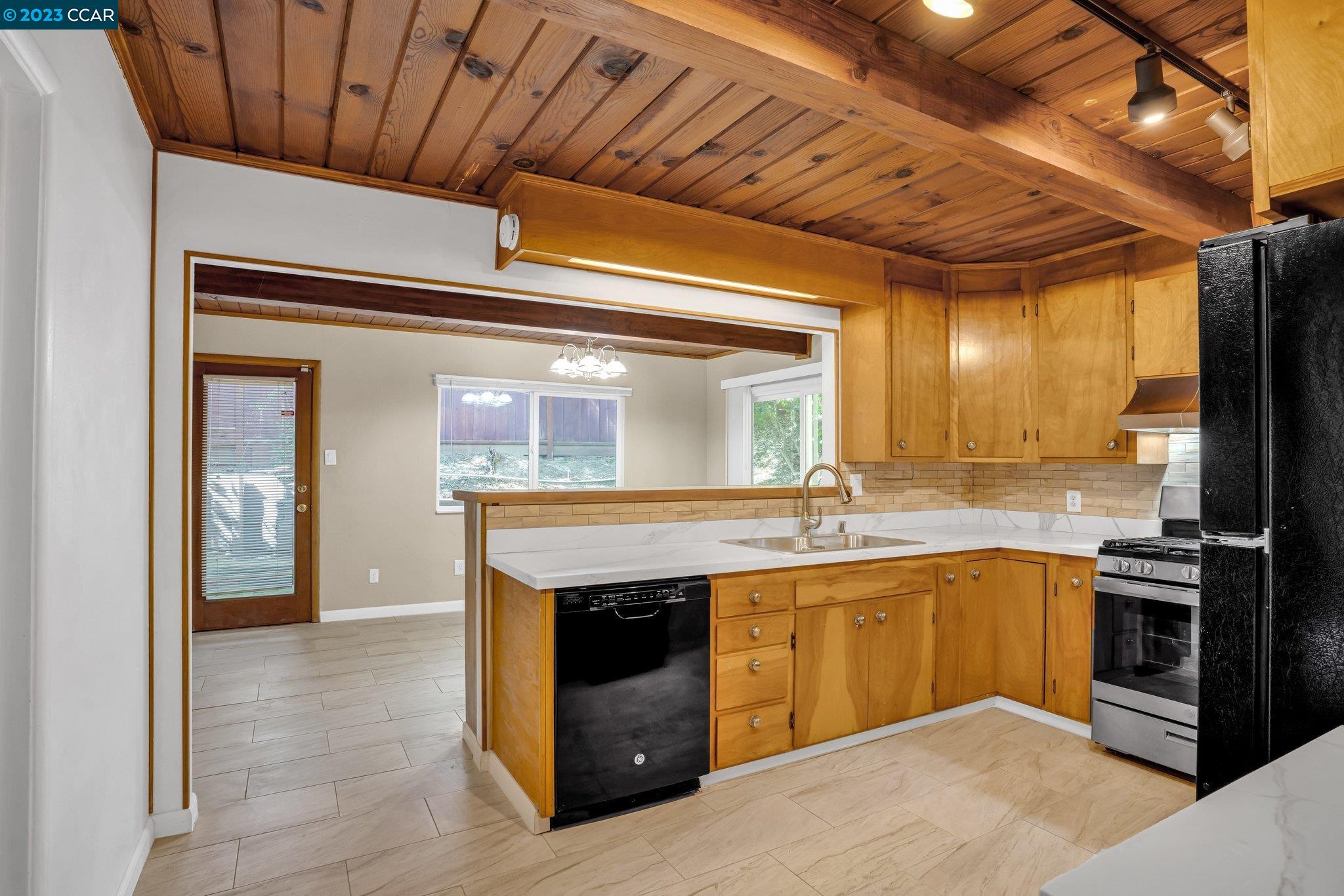 928 Janet Lane Lafayette, CA 94549 - Photo 7 of 33 a kitchen with stainless steel appliances granite countertop a stove and a sink