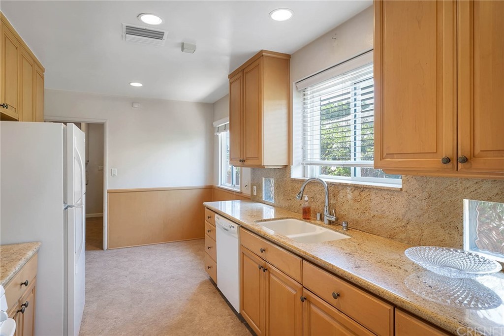 4906 Van Noord Avenue Sherman Oaks, CA 91423 - Photo 12 of 39 a kitchen with a sink and a refrigerator