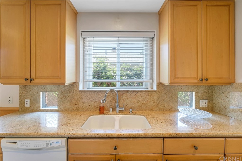 4906 Van Noord Avenue Sherman Oaks, CA 91423 - Photo 14 of 39 a kitchen with granite countertop white cabinets and a sink