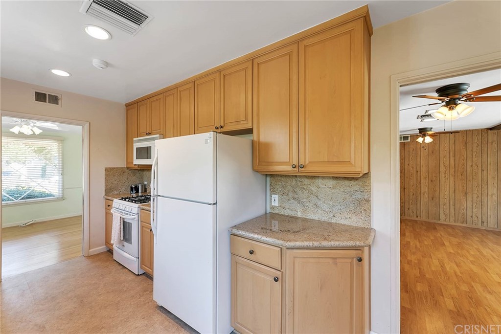 4906 Van Noord Avenue Sherman Oaks, CA 91423 - Photo 17 of 39 a white refrigerator freezer sitting in a kitchen