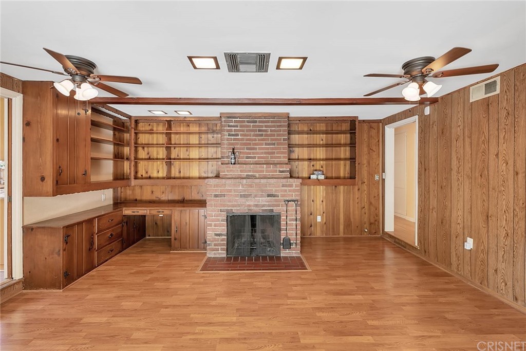 4906 Van Noord Avenue Sherman Oaks, CA 91423 - Photo 22 of 39 a view of a hallway with a cabinet and a fireplace