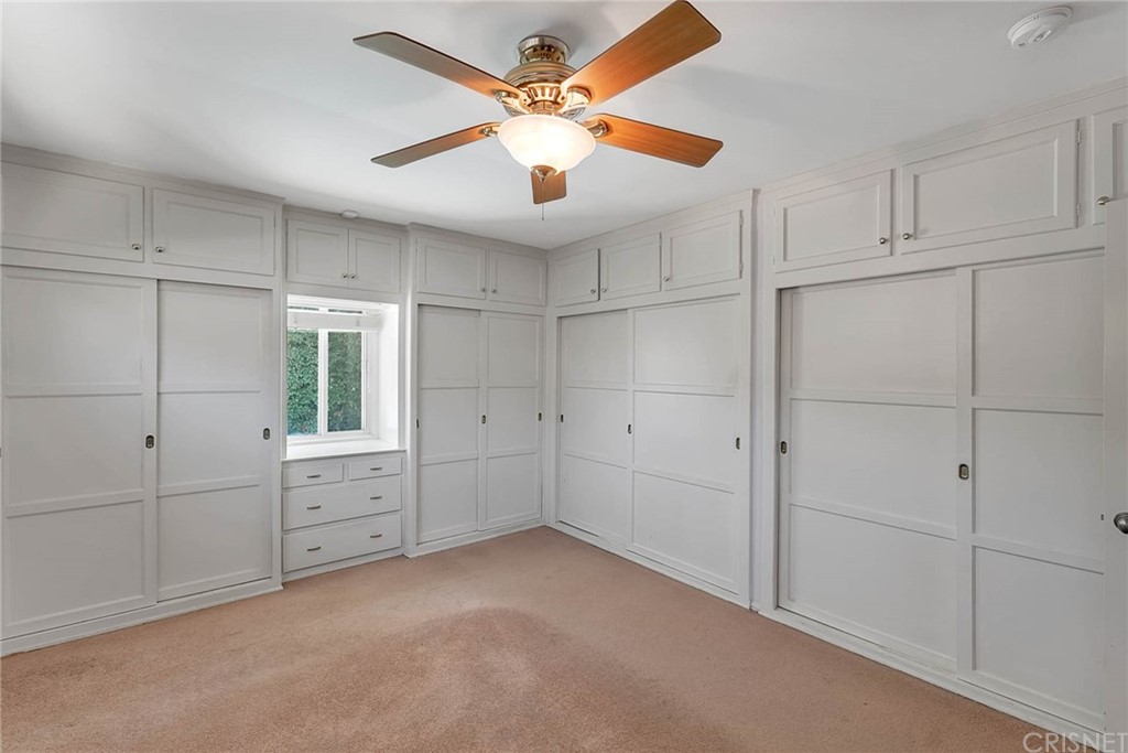 4906 Van Noord Avenue Sherman Oaks, CA 91423 - Photo 26 of 39 a view of an empty room with cabinet and a ceiling fan
