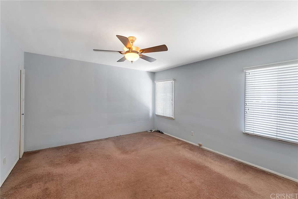 4906 Van Noord Avenue Sherman Oaks, CA 91423 - Photo 28 of 39 an empty room with a window and a fan
