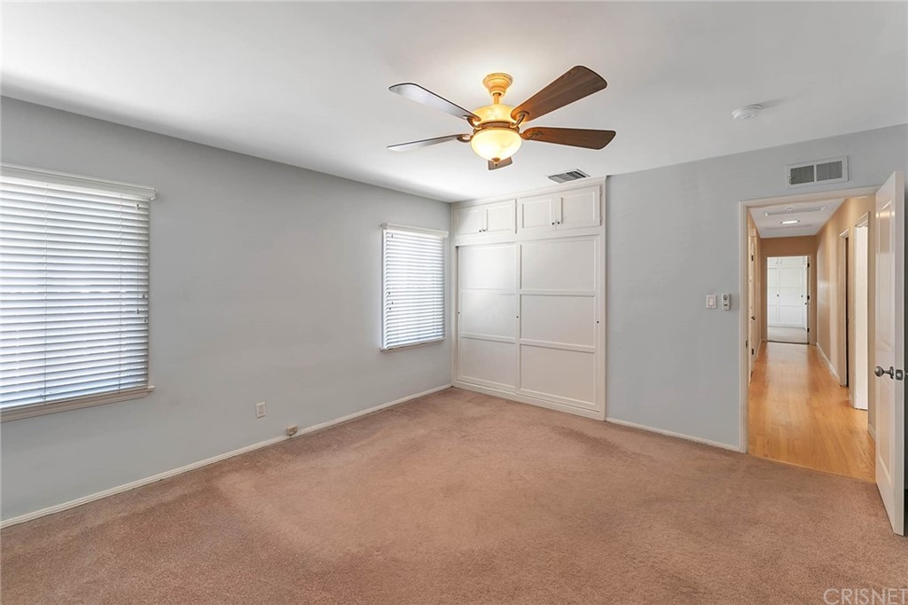 4906 Van Noord Avenue Sherman Oaks, CA 91423 - Photo 29 of 39 an empty room with windows and fan