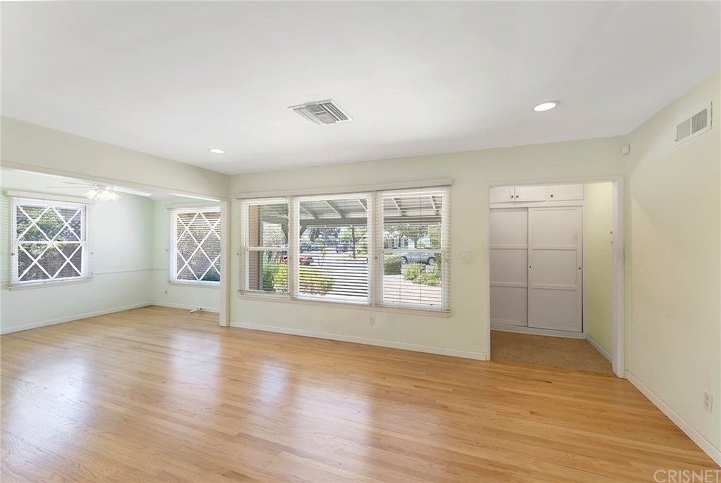 4906 Van Noord Avenue Sherman Oaks, CA 91423 - Photo 5 of 39 a view of an empty room with wooden floor and a window