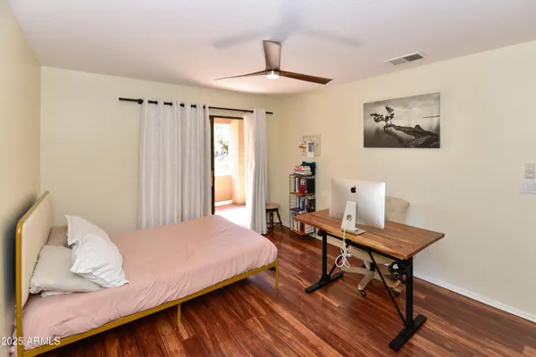 a bedroom with a bed and a table in it