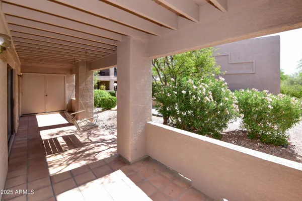 a view of a back yard from a balcony