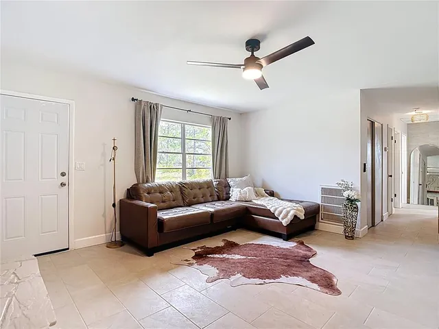 a view of a livingroom with furniture and window