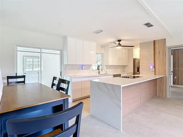 a spacious bedroom with a bed and a window