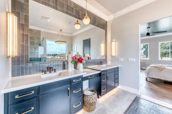 a spacious bathroom with a sink double vanity and a mirror