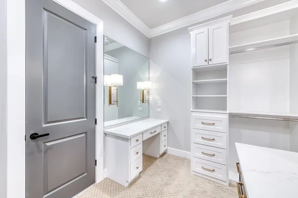 a room with a closet and a mirror