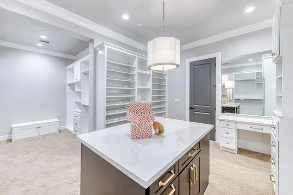 a kitchen with a refrigerator a sink and a wooden cabinets
