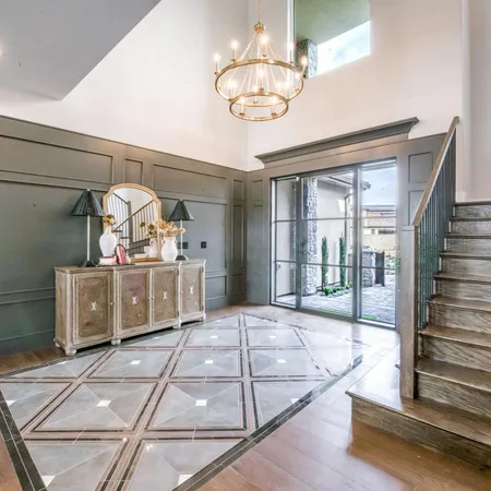 a view of a entryway door with hallway