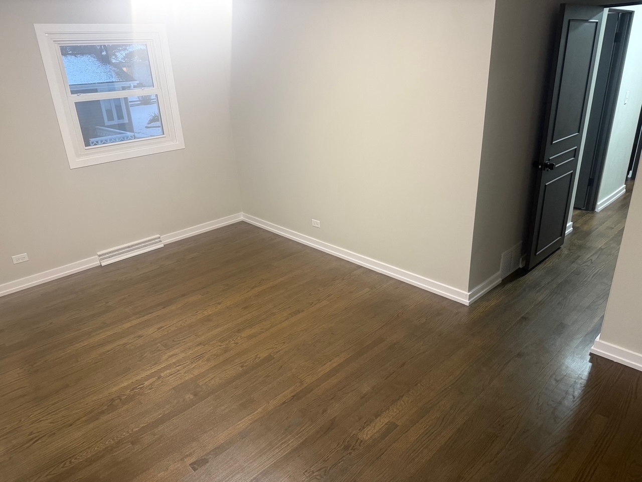 126 Rosedale Court Bloomingdale, IL 60108 - Photo 16 of 26 an empty room with wooden floor and windows