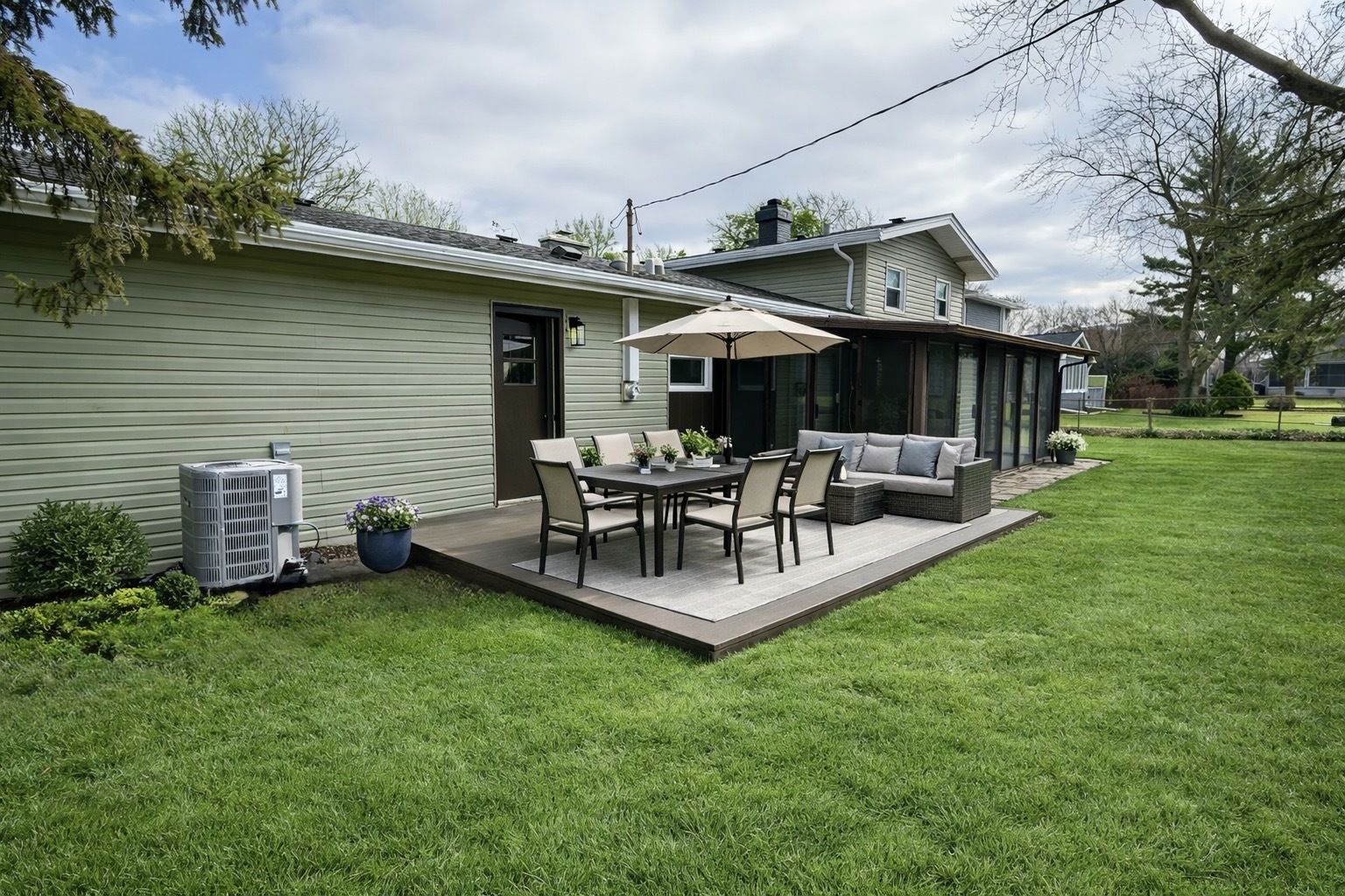 126 Rosedale Court Bloomingdale, IL 60108 - Photo 24 of 26 a view of a patio with table and chairs potted plants and large tree