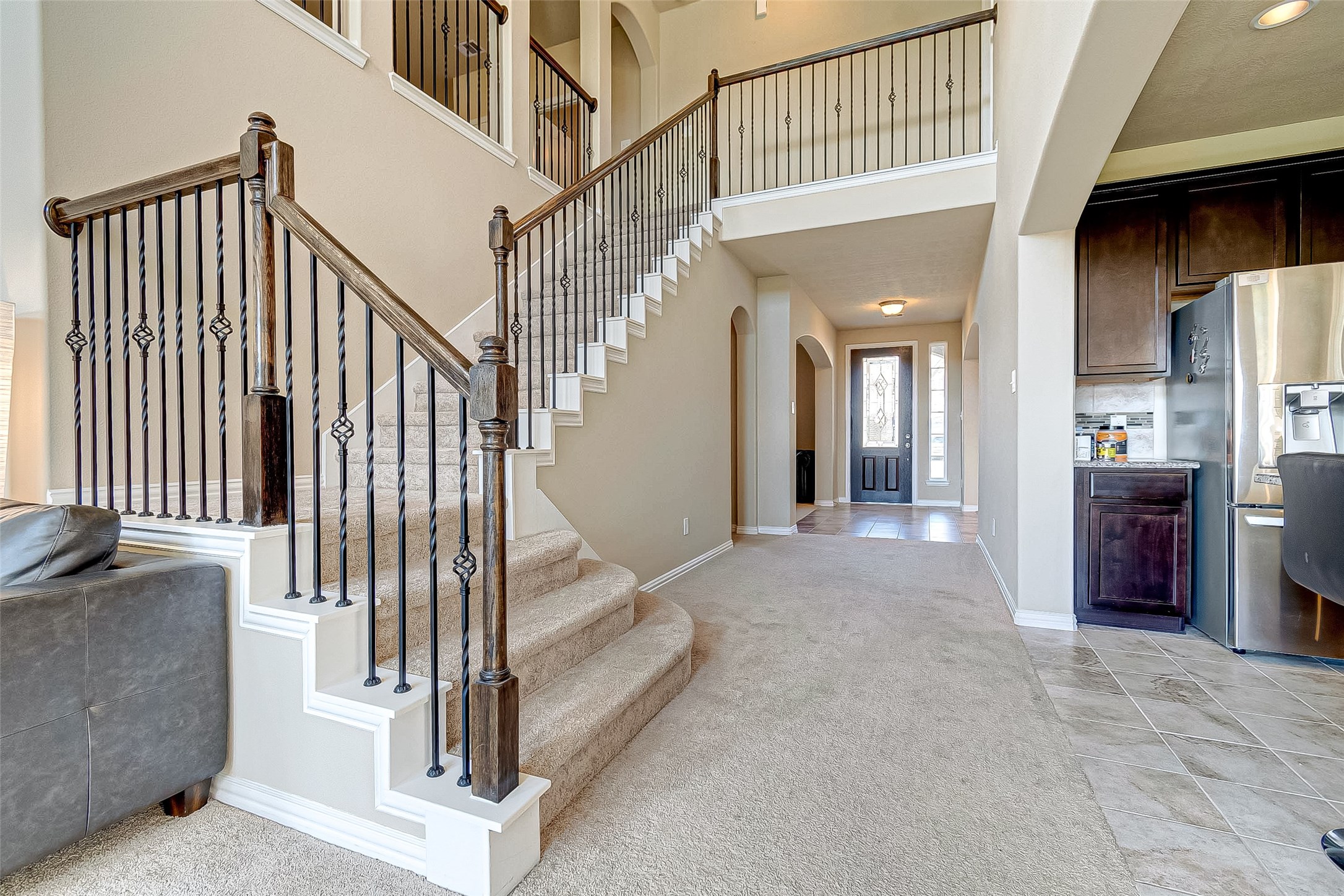 907 River Delta Lane Rosenberg, TX 77469 - Photo 11 of 49 a view of staircase and living room with a couch