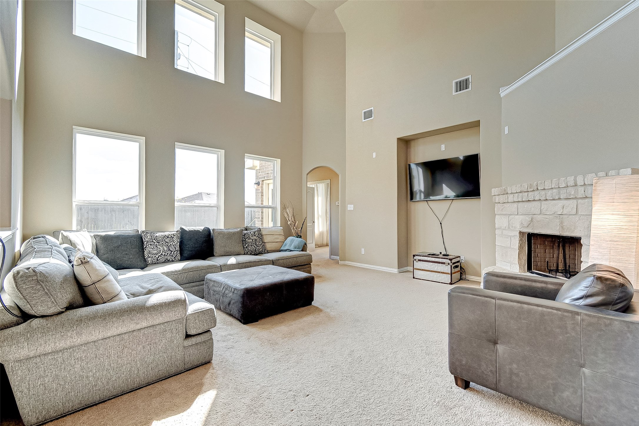 907 River Delta Lane Rosenberg, TX 77469 - Photo 12 of 49 a living room with furniture a fireplace and a flat screen tv