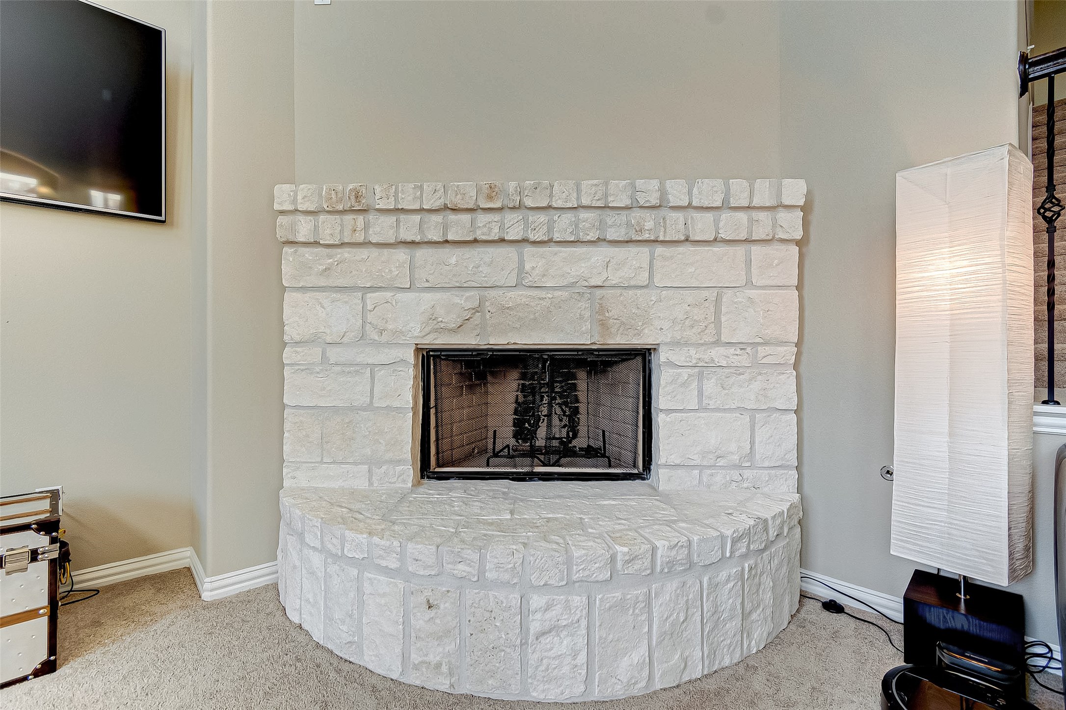 907 River Delta Lane Rosenberg, TX 77469 - Photo 15 of 49 a living room with a fireplace and a flat screen tv