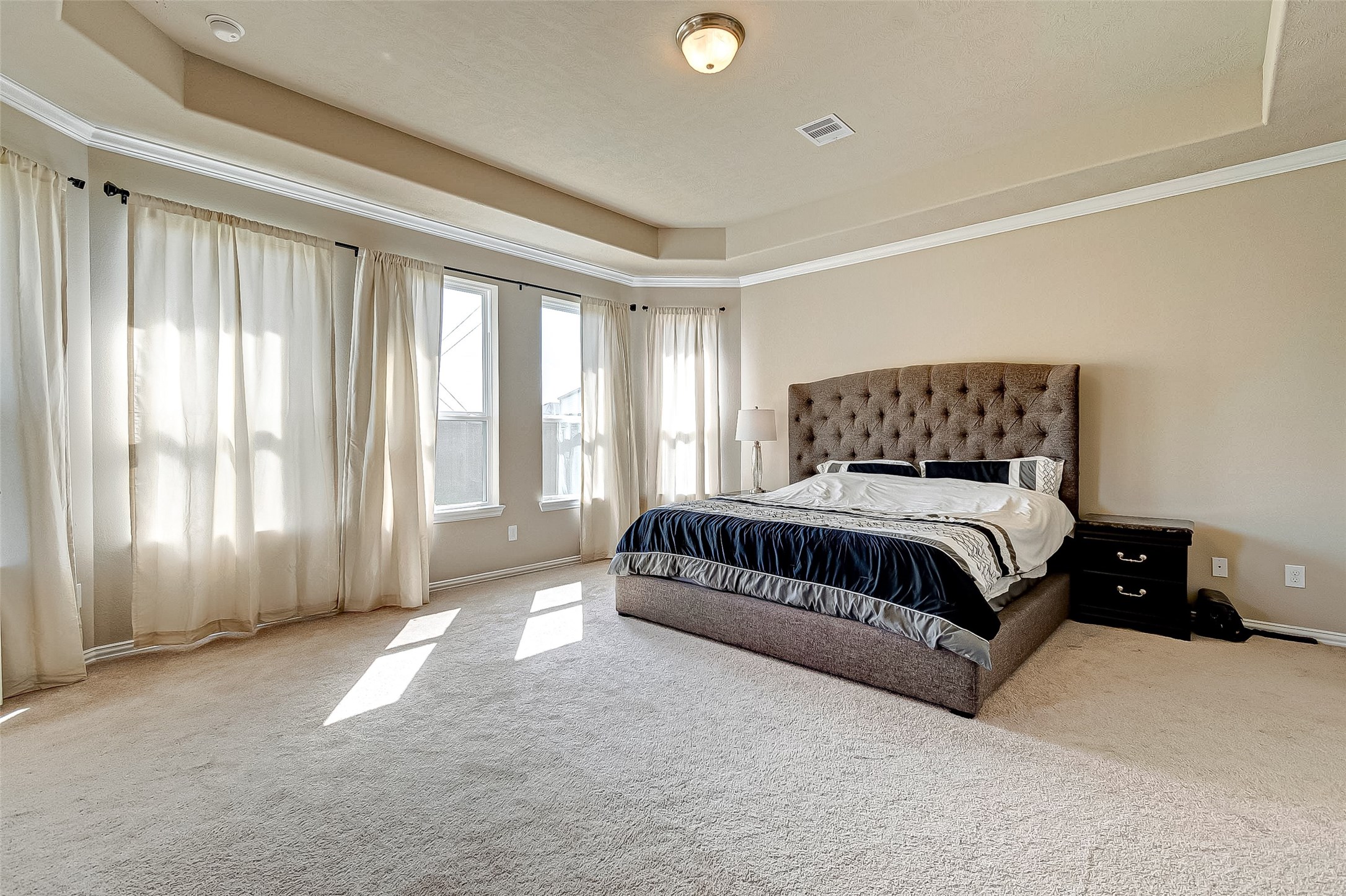 907 River Delta Lane Rosenberg, TX 77469 - Photo 26 of 49 a spacious bedroom with a bed and a window