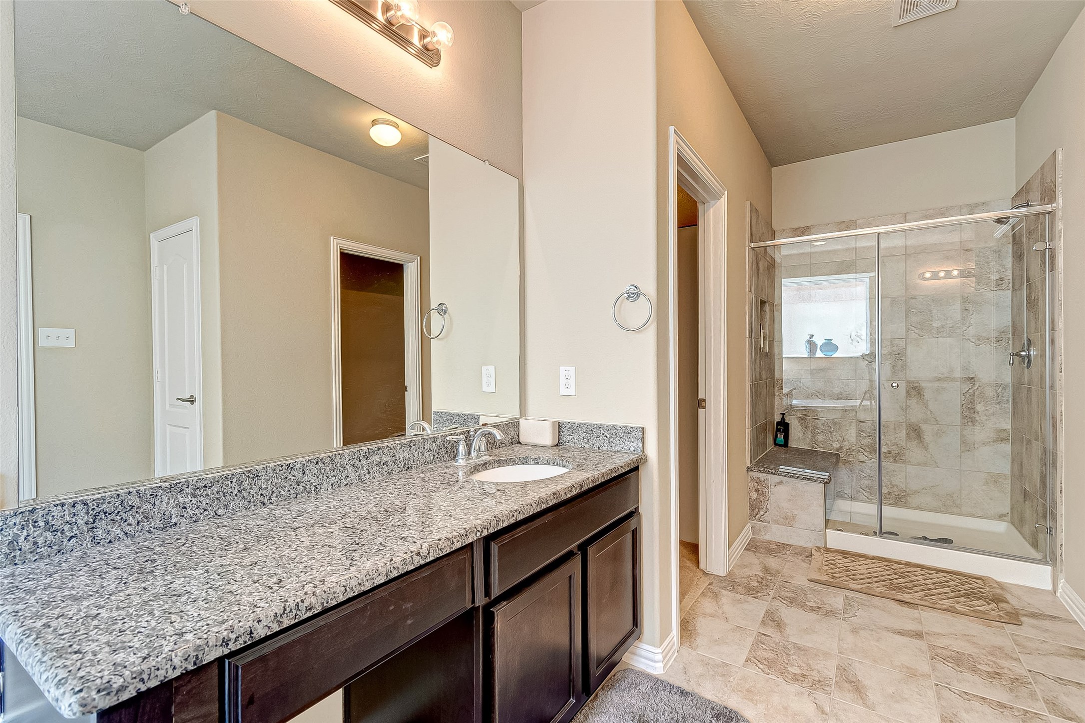 907 River Delta Lane Rosenberg, TX 77469 - Photo 30 of 49 a bathroom with a granite countertop sink and mirror