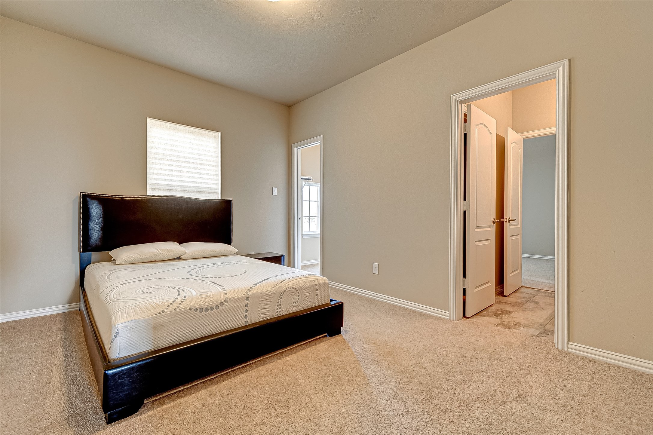 907 River Delta Lane Rosenberg, TX 77469 - Photo 35 of 49 a bedroom with a bed and a window