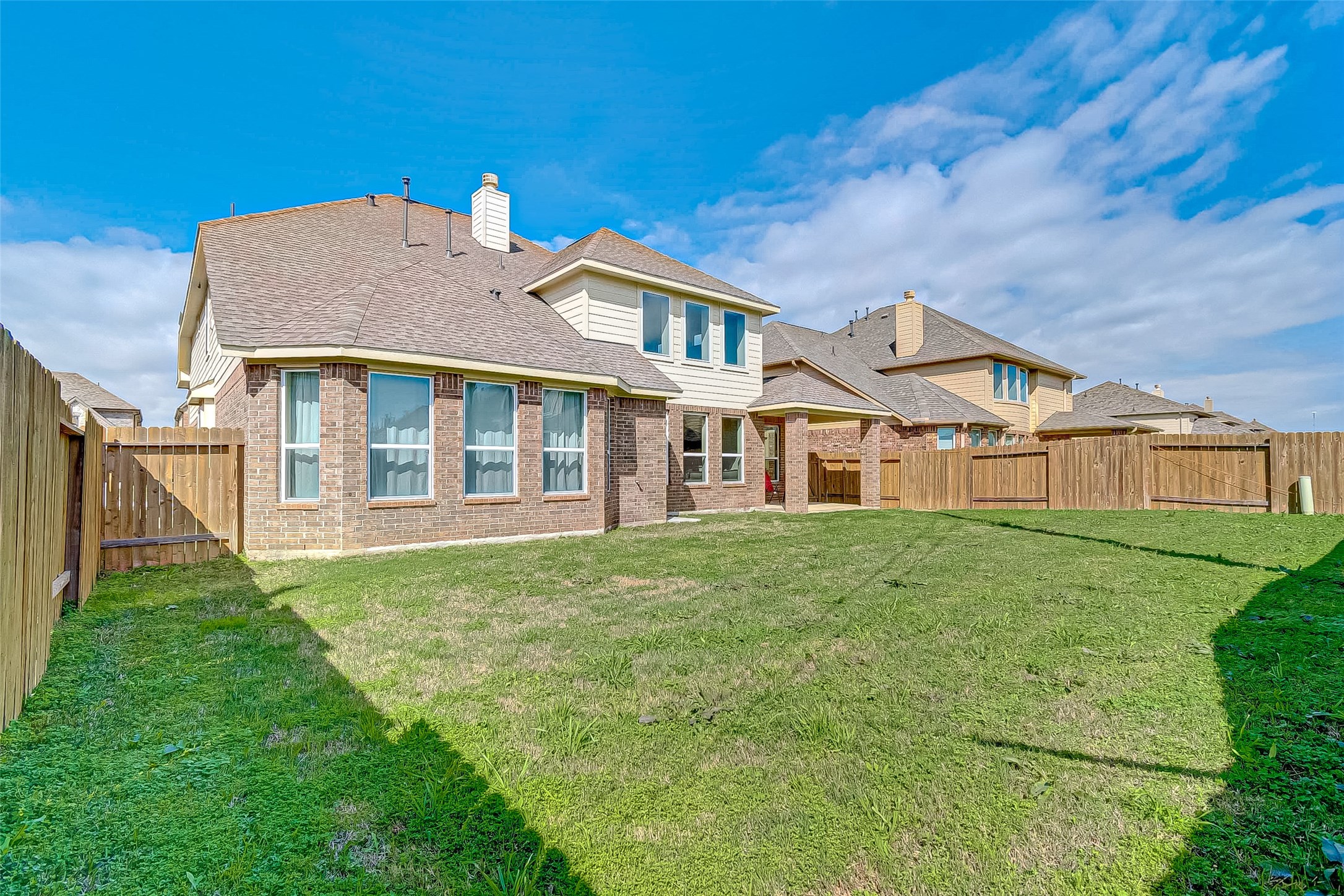 907 River Delta Lane Rosenberg, TX 77469 - Photo 48 of 49 a view of a yard in front of a house with a big yard