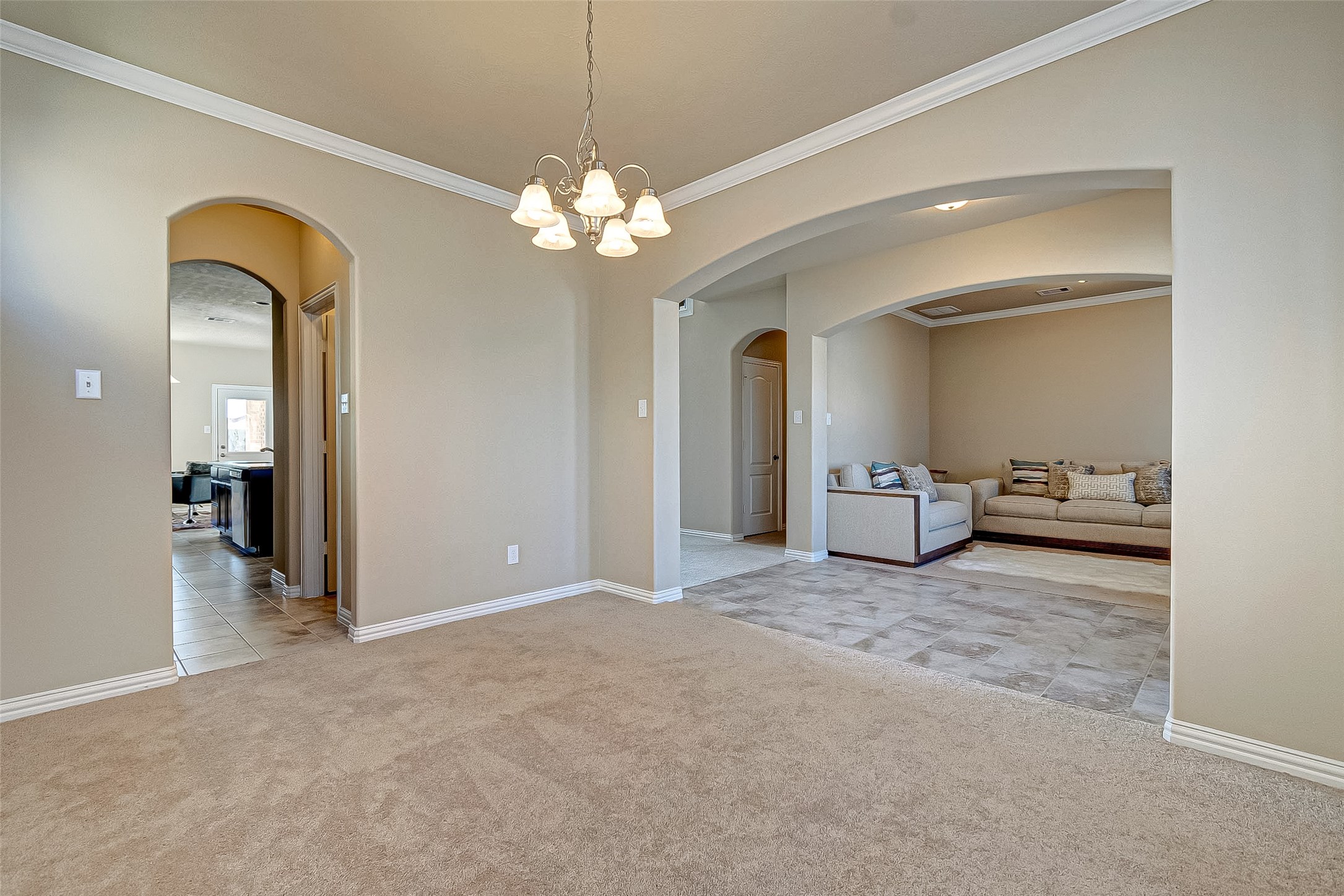 907 River Delta Lane Rosenberg, TX 77469 - Photo 10 of 49 wooden floor with chandelier and glass door