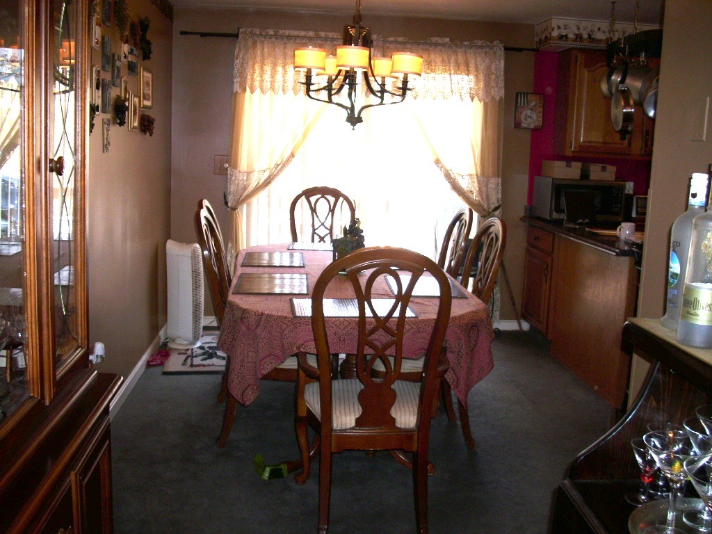 902 Irving Road, Unit 902 Randolph, MA 02368 - Photo 11 of 15 a view of a dining room with furniture window and outside view
