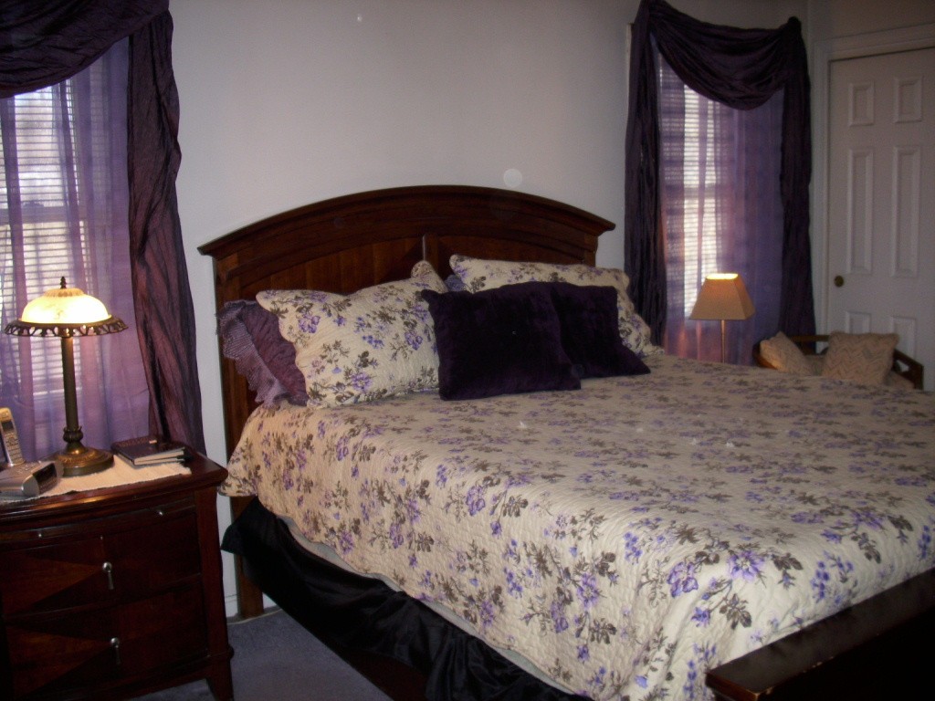 902 Irving Road, Unit 902 Randolph, MA 02368 - Photo 12 of 15 a bedroom with a bed and a lamp