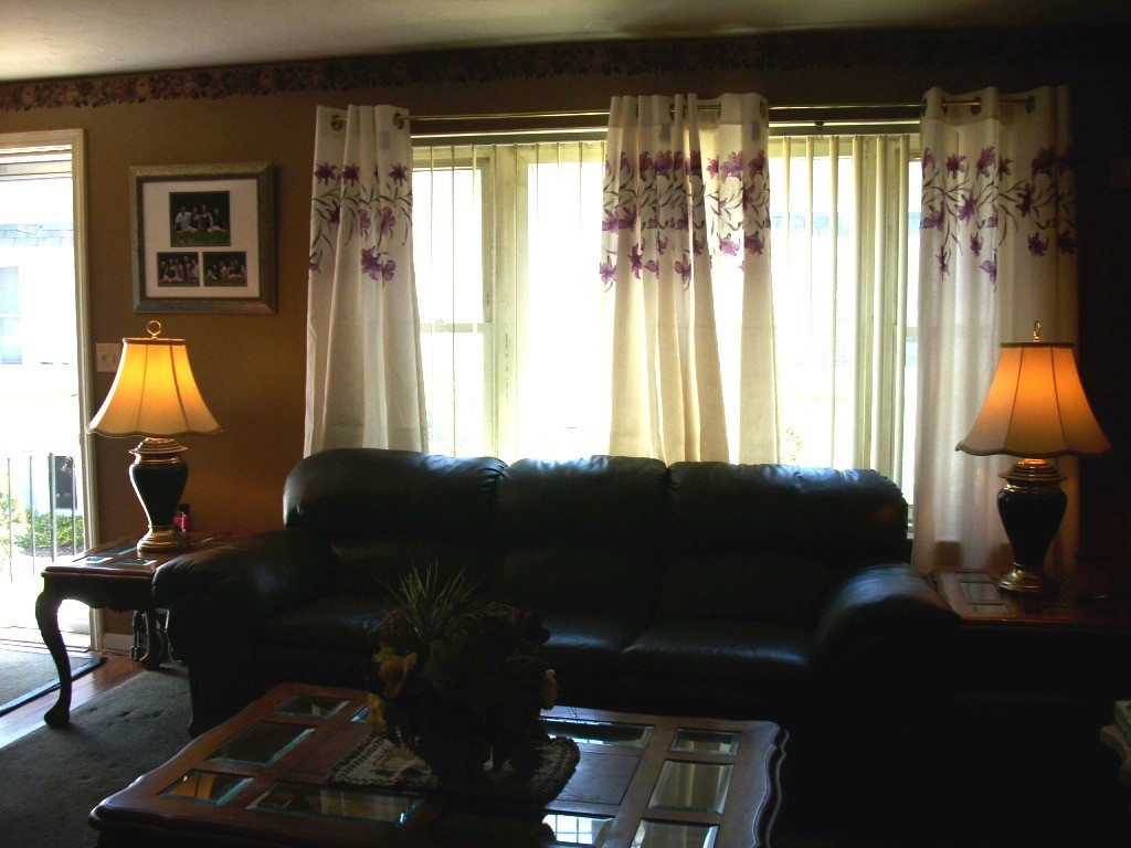 902 Irving Road, Unit 902 Randolph, MA 02368 - Photo 3 of 15 a living room with furniture and a window