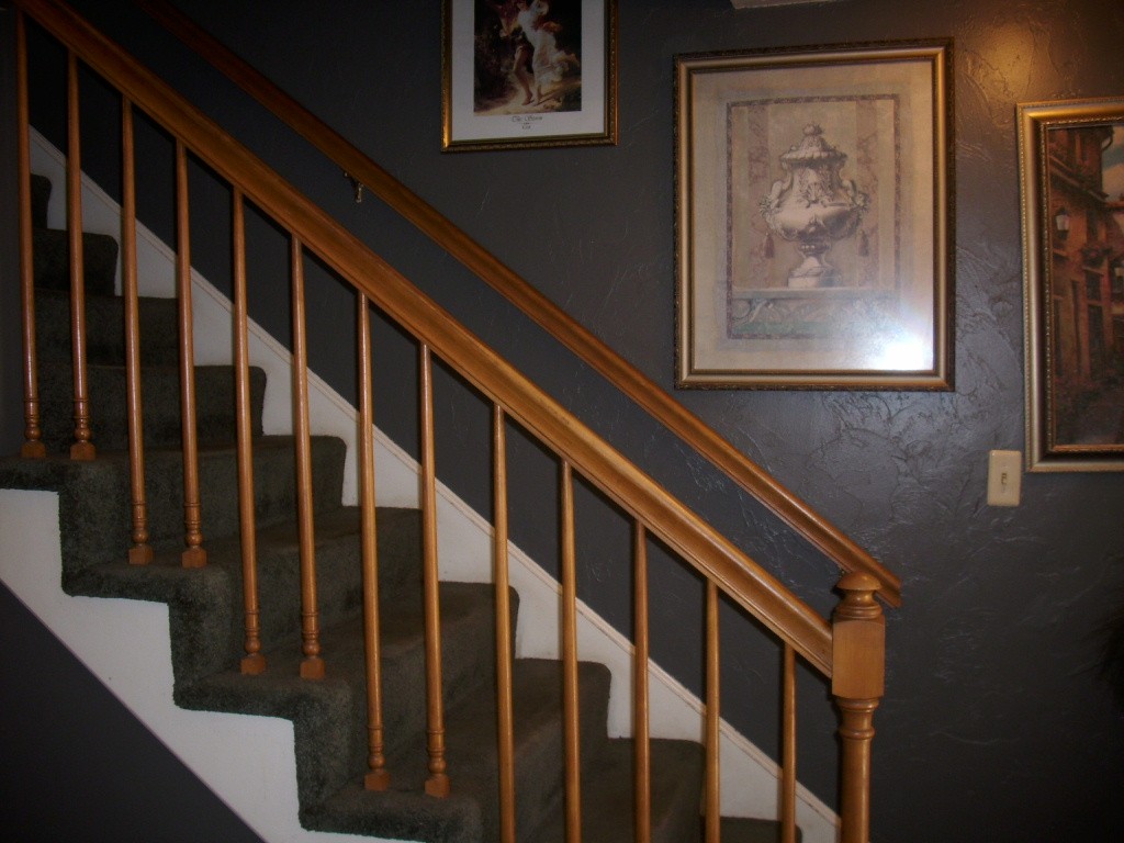 902 Irving Road, Unit 902 Randolph, MA 02368 - Photo 6 of 15 a view of wooden staircase