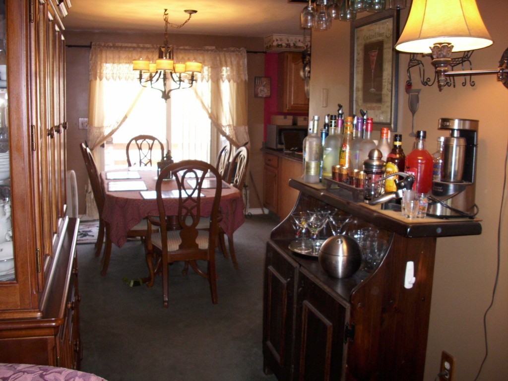 902 Irving Road, Unit 902 Randolph, MA 02368 - Photo 10 of 15 a view of a dining room with furniture and chandelier