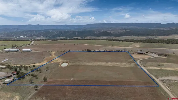 a view of a swimming pool and mountain view
