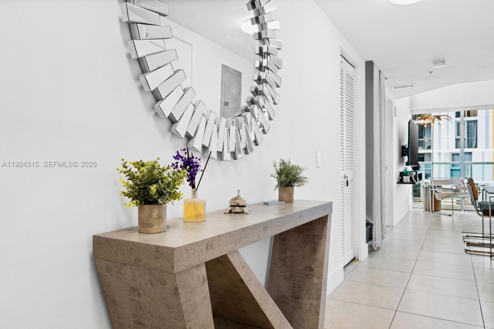 41 Southeast 5th Street, Unit 510 Miami, FL 33131 - Photo 14 of 38 a dining room with furniture and chandelier