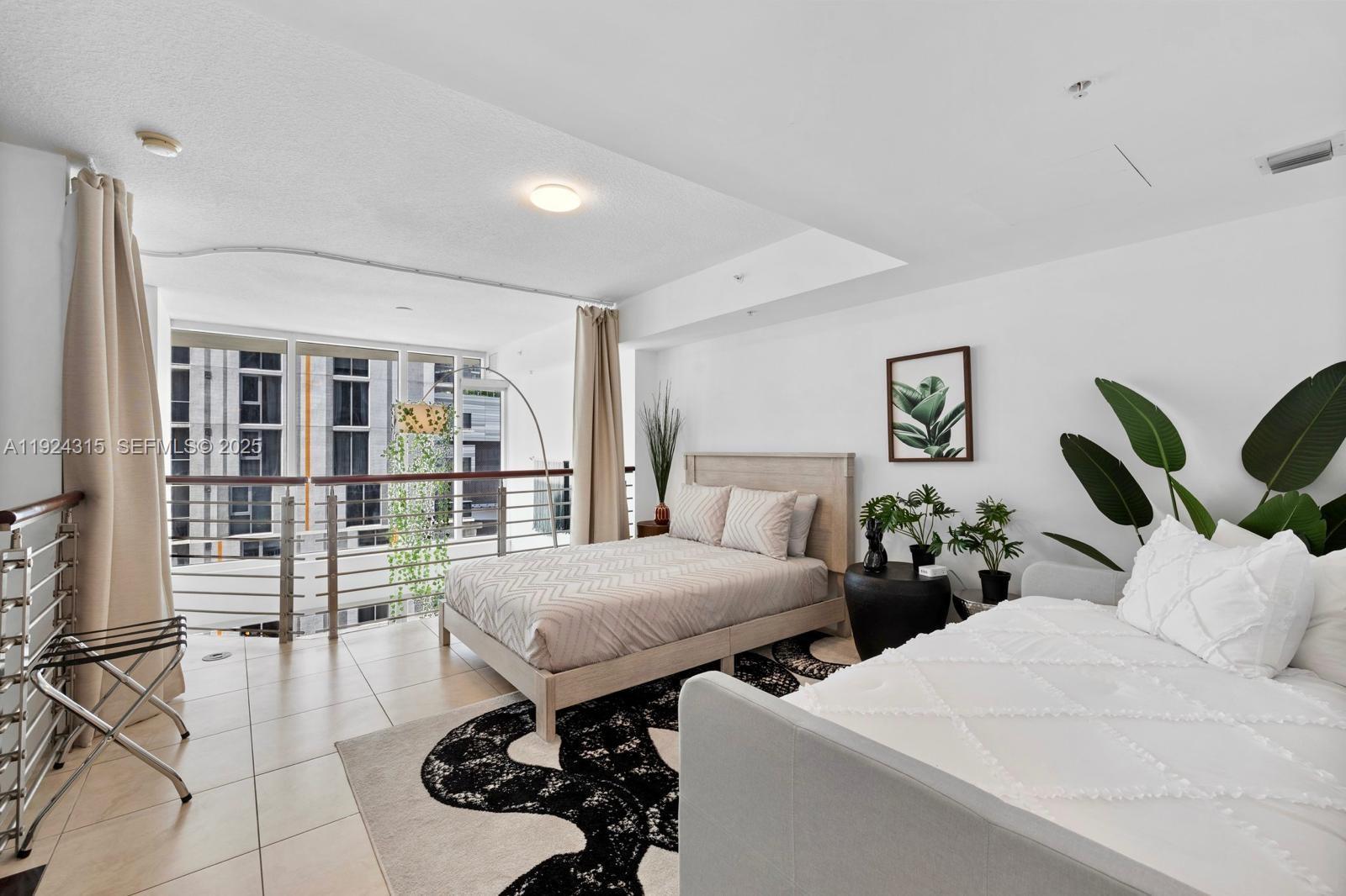 41 Southeast 5th Street, Unit 510 Miami, FL 33131 - Photo 23 of 38 a living room with furniture and a table