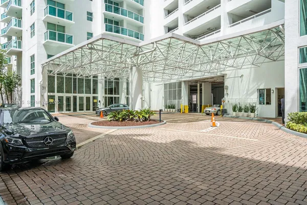 a view of a car park in front of a building
