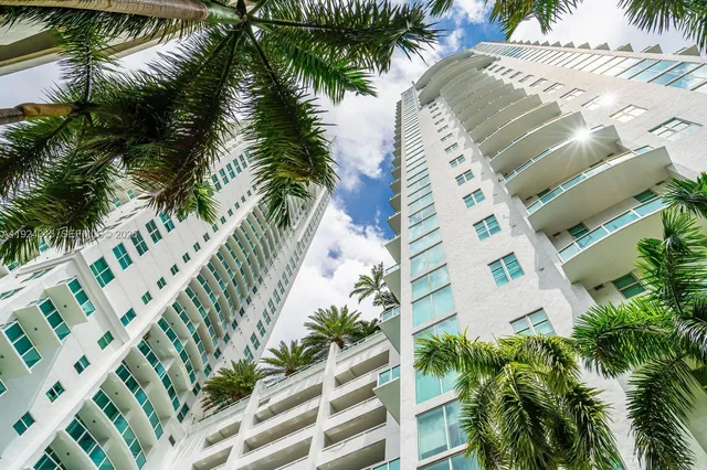 a view of balcony with a palm tree