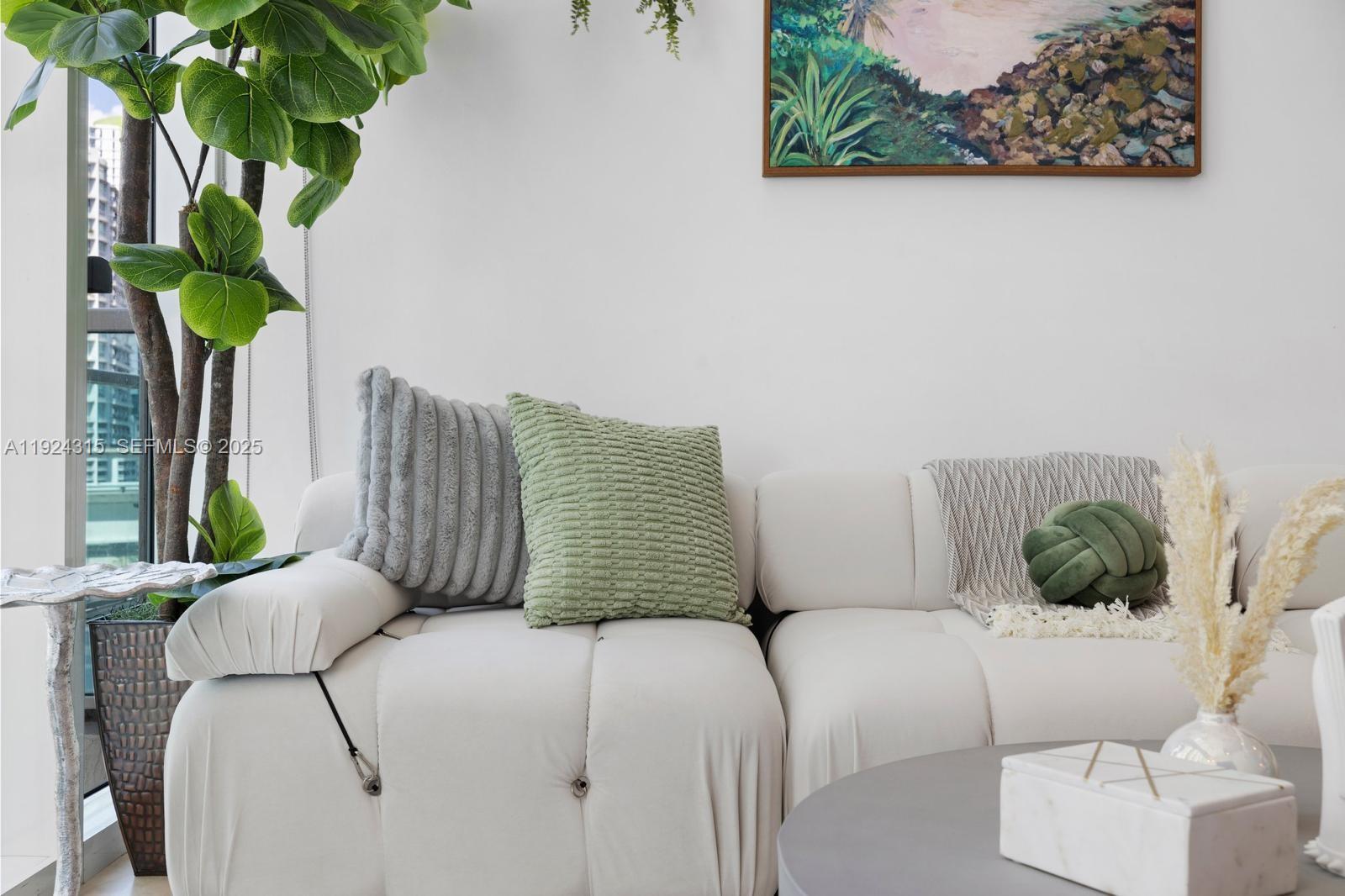 41 Southeast 5th Street, Unit 510 Miami, FL 33131 - Photo 5 of 38 a bedroom with a bed potted plant and a window