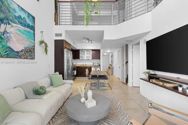 a living room with furniture and a flat screen tv