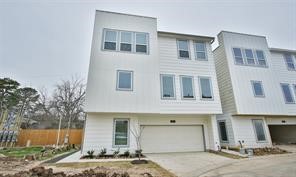 1905 Lonestar Brook Lane Houston, TX 77080 - Photo 1 of 23 a front view of a house with garden
