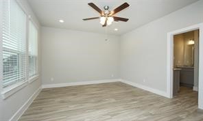 1905 Lonestar Brook Lane Houston, TX 77080 - Photo 18 of 23 wooden floor in an empty room with a window